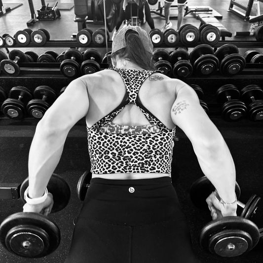 Person lifting weights in a gym setting